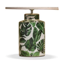 ceramic table lamp decorated with exotic leaves.