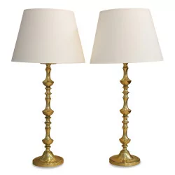 Pair of turned brass torchiere lamps.