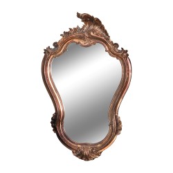 Miroir avec cadre en métal cuivré.