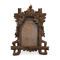 Carved wooden frame from Brienz decorated with oak leaves. …