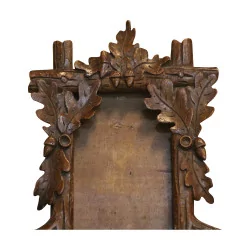 Carved wooden frame from Brienz decorated with oak leaves. …