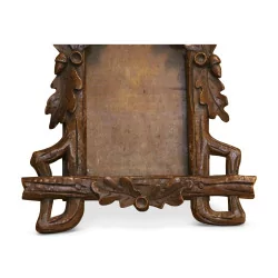 Carved wooden frame from Brienz decorated with oak leaves. …