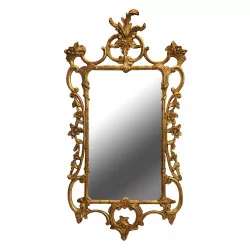 Louis XV mirror with gilded wooden frame.