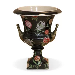 Porcelain vase painted with floral motifs on a black background and …