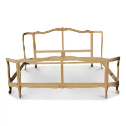 A Louis XV beech bed with basket head and feet