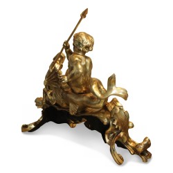 Pair of andirons with Putti and dragon in gilded bronze.