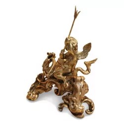 Paire de chenets au Putti et au dragon en bronze doré.
