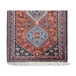 Oriental rug in red and blue tones.