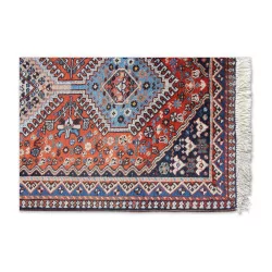 Oriental rug in red and blue tones.