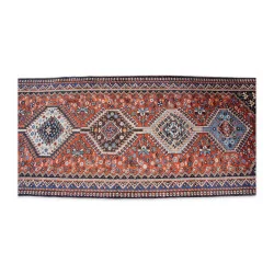 Oriental rug in red and blue tones.