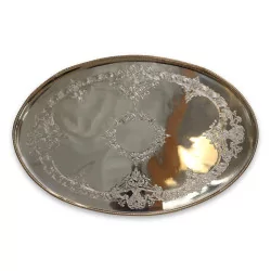Oval silver tray with decorations.