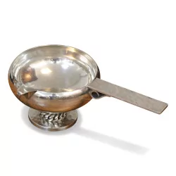 An 800 silver sauce boat on a hammered foot