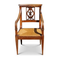 Fauteuil Directoire paillé à palmette fleur de lys. Vers 1820. …