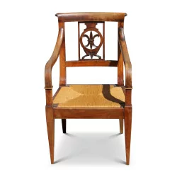 straw-covered Directoire armchair with fleur-de-lys palmette. Around 1820. …