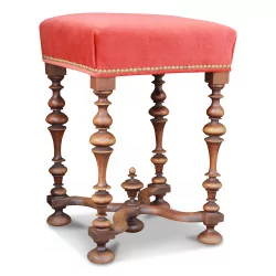 Louis XIII stool covered in red fabric.