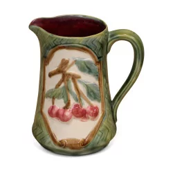 slip pitcher decorated with cherries.