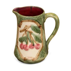 slip pitcher decorated with cherries.