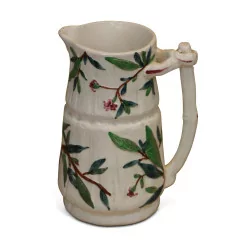 slip pitcher decorated with flowering branches.