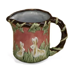 slip pitcher decorated with rabbits.
