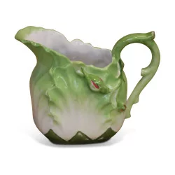 Small slip pitcher in the shape of lettuce leaves.