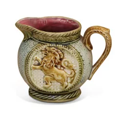 Small slip pitcher decorated with lions.