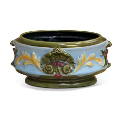 Slip pot decorated with flowers.