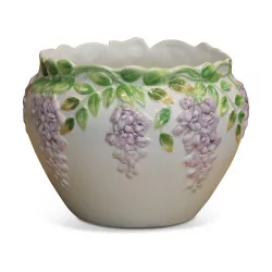 Slip pot decorated with wisteria flowers.