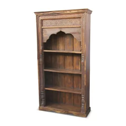 Indian bookcase in carved exotic wood.