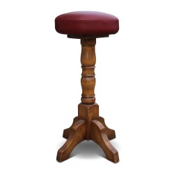 A pair of red leather bar stools