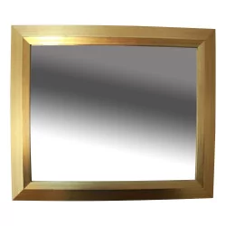 Contemporary mirror with a gilt cut-off frame.