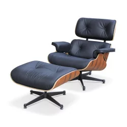 Ein „Eames“-Sessel mit hoher Rückenlehne und Fußstütze