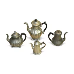 A set of 4 decorative pewter teapots