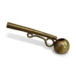A gray metal hunting whistle.
