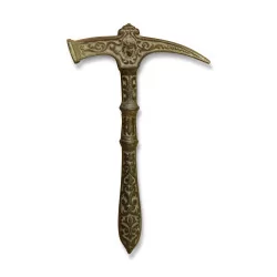 A decorative bronze hammer.