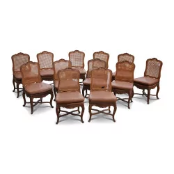 A set of twelve Louis XV regency beech chairs