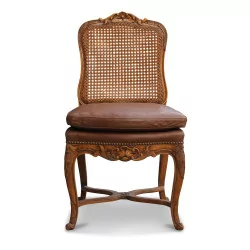 A set of twelve Louis XV regency beech chairs