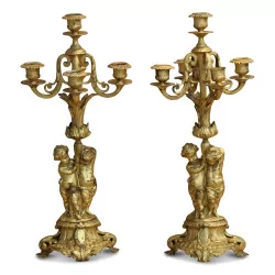 Pair of Napoleon III candlesticks in zaponed golden cast iron. Towards …