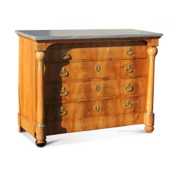 A Swiss Empire chest of drawers with columns.