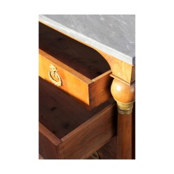 A Swiss Empire chest of drawers with columns.