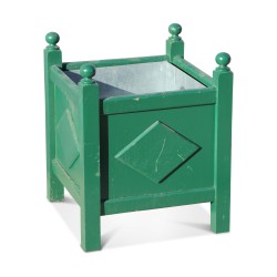 A green flower box \"with diamonds and balls\".