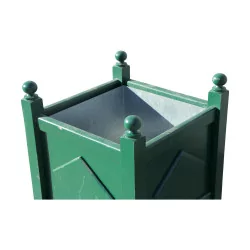 A green flower box \"with diamonds and balls\".