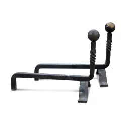 A pair of wrought iron andirons with brass ball.