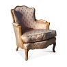 Une bergère de style Louis XV mouluré Vintage. - Moinat - Fauteuils