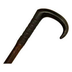 Pistol gadget cane with a black butt.