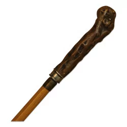Cane with a wooden handle.
