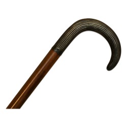 Canne avec un manche gouttière en métal argenté.