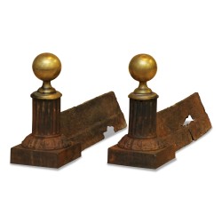Pair of Directoire andirons in cast iron and bronze.
