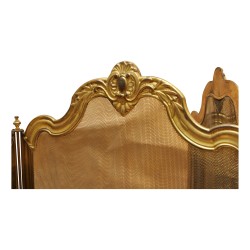 Firewall with four brass shutters and metal grille.