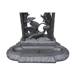 Cast iron umbrella holder.