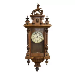 A Henri II clock in walnut. Missing piece of wood.